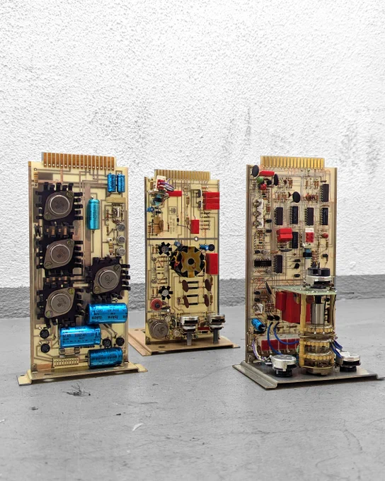 Light brown circuit board with various elements, three pieces.
