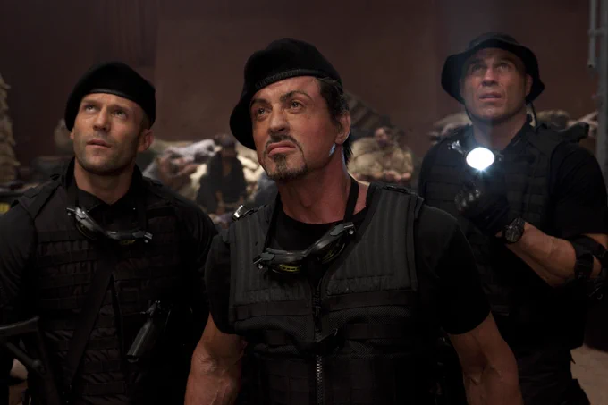 Jason Statham, Sylvester Stallone, and Randy Couture in The Expendables.