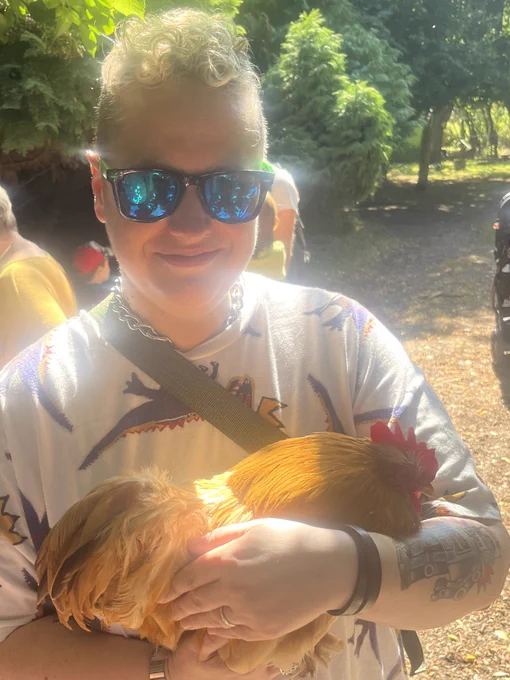Person holding chicken that is glowing in sunlight