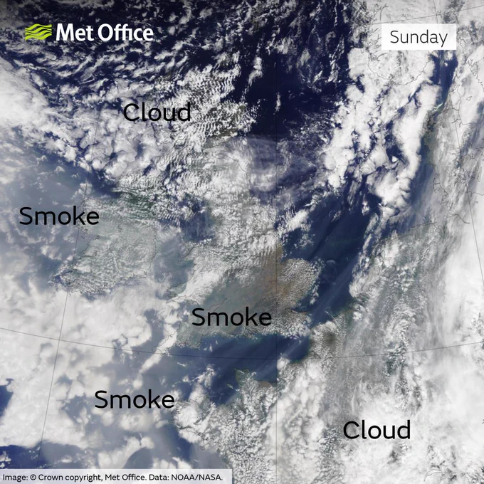 Satellite view of the UK taken on Sunday 18th August 2024. It shows a mixture of cloud and clear skies across the UK with smoke evident, especially in the south.