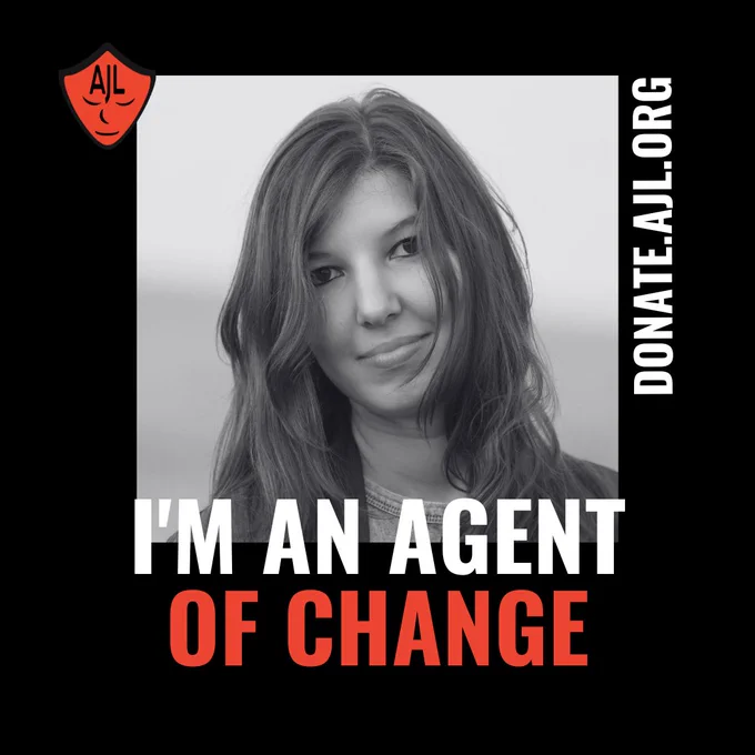 Black and white image of a white woman with brown hair looking at the camera. White and red text underneath the picture in the middle of the screen reads "I'M AN AGENT OF CHANGE." The AJL red logo is in the top lefthand corner of the image, with DONATE.AJL.ORG vertically positioned on the left side of the image.