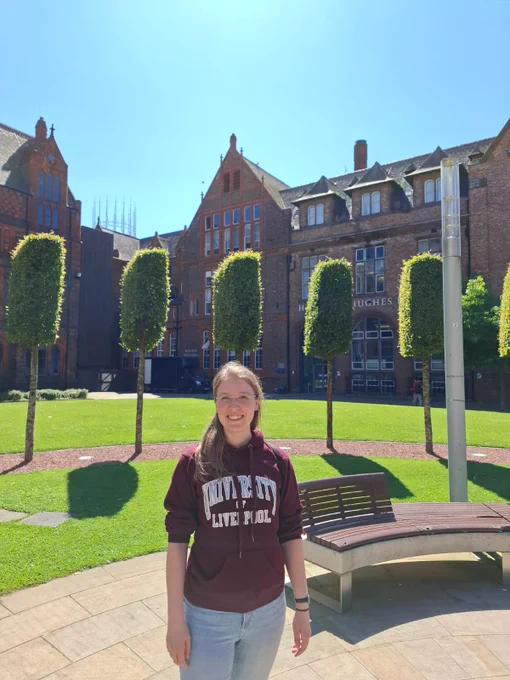 Angelika standing in front of the red bricks buildings of Liverpool University 