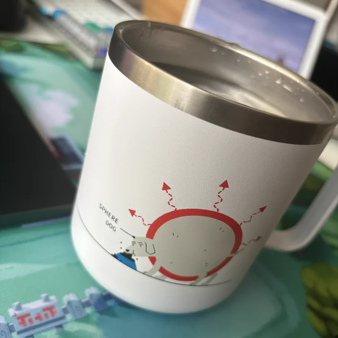 A yeti mug with a 2D illustration of a large, round spherical dog labeled “sphere dog”