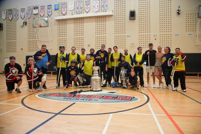 Carter Verhaeghe and the Burlington Bobcats and the Hamilton Steel Hawks Special Hockey Teams pose with the Stanley Cup.