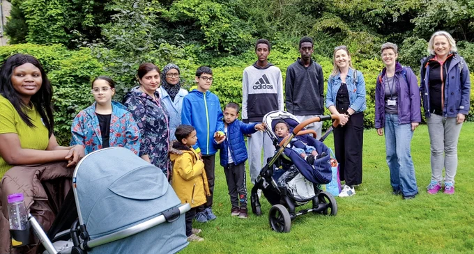 Group photo of Women's Collective members and staff in the Royal Botanic Garden Edinburgh