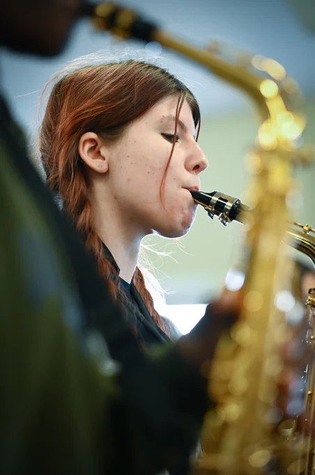 Photo of female saxophone player in a music class at Camden School for Girls.