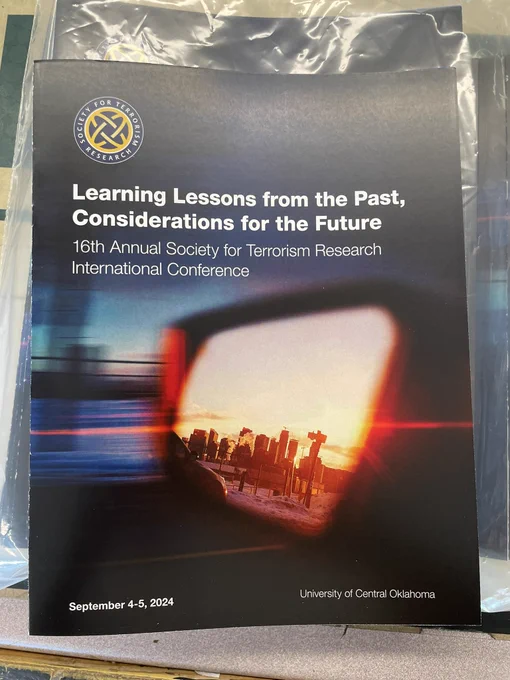 Image of the front cover of the STR program for the conference in September.