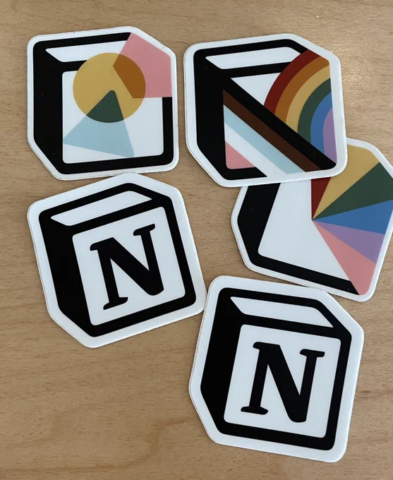 Picture of various Notion logo stickers, some classic some with colorful additions