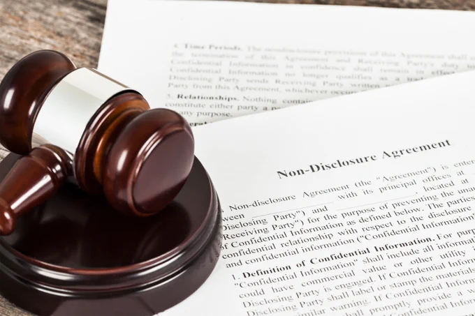 Stack of legal papers and gavel.