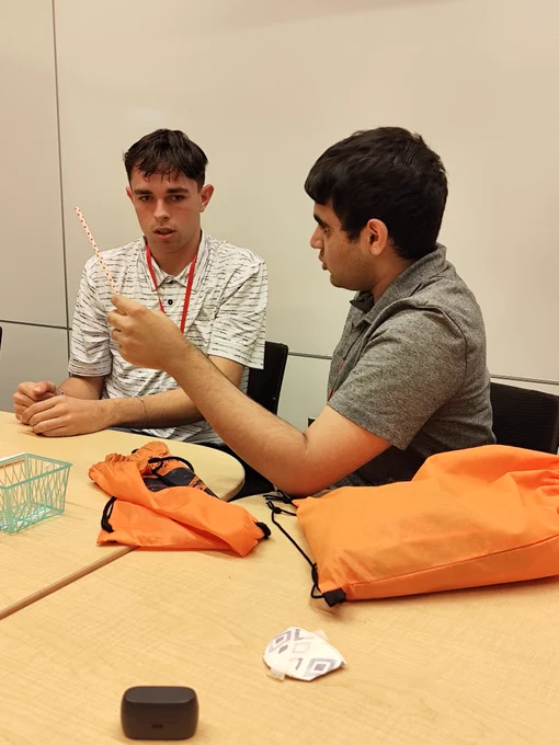 Two WAS Red Team Scholars planning for the upcoming engineering challenge.