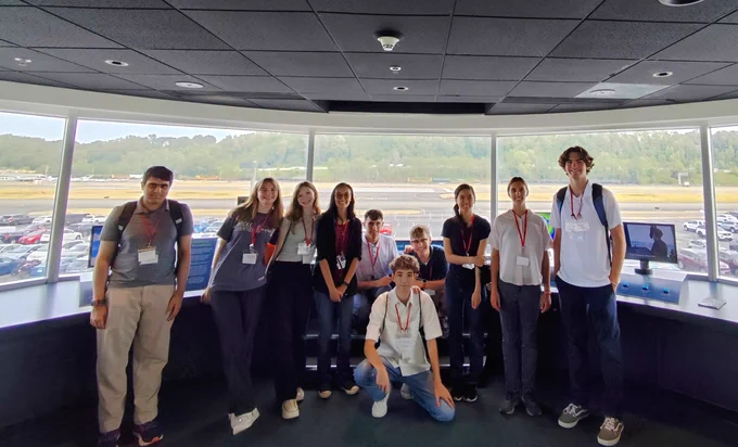 WAS Red Team taking a group picture in the command tower at the Museum of Flight.