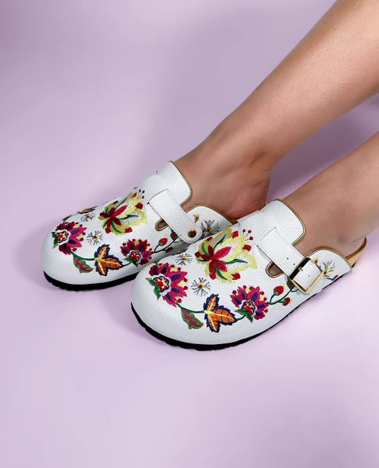 Irregular Choice 'Growing Free' white closed-toe mules. Folksy embroidered flowers and gold details.