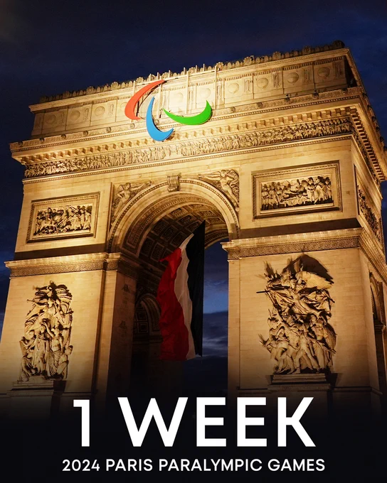 A photo of the Arc de Triomphe lit up at night with the Paralympic symbol, the Agitos, displayed in the center with the text, "1 week 2024 Paris Paralympic Games".