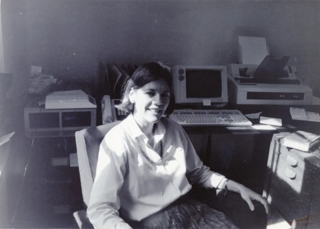 An black and white image of Senator Elizabeth Warren sitting at a desk, exact date unknown.