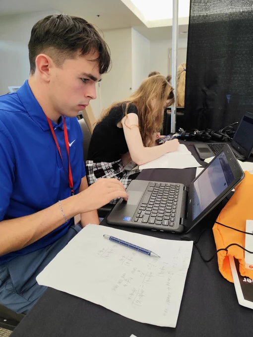 Two WAS Scholars calculating the mission's rocketing propulsion systems.