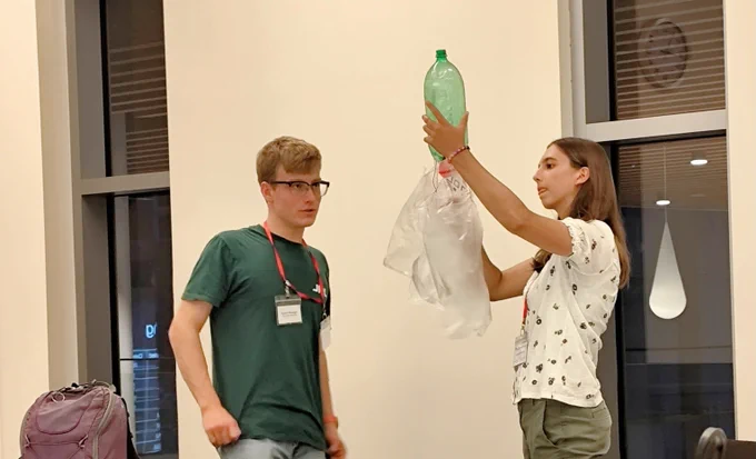Two Scholars designing the rocket prototype for the engineering challenge.