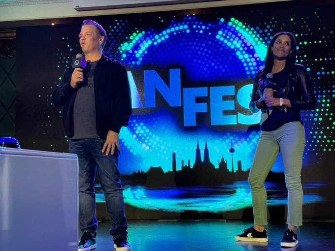 A photo taken at the Xbox FanFest showing Phil Spencer and Sarah Bond on stage