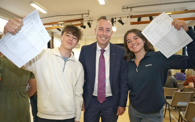 Education Minister Paul Givan pictured at Dromore High School with pupils receiving GCSE results.