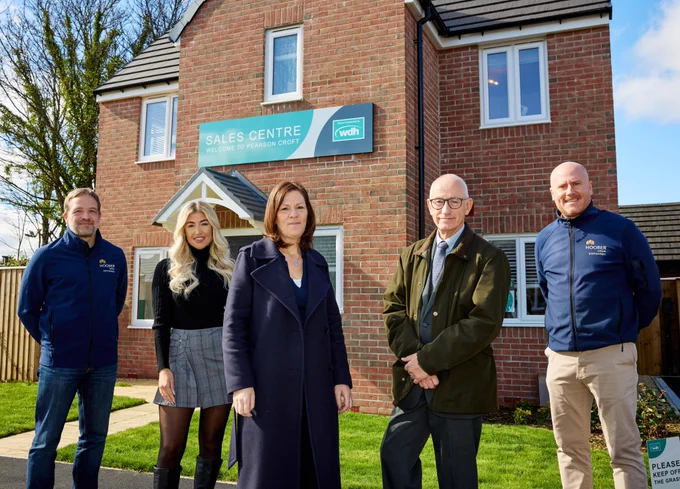 Sue Young, Executive Director for Investment at WDH, is pictured centre with colleagues and partners at a new housing development in Wombwell, Barnsley.