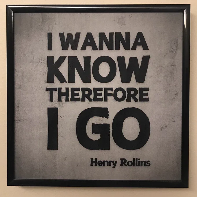 Framed photo features a quote from Henry Rollins. Text reads: "I wanna know, therefore I go."