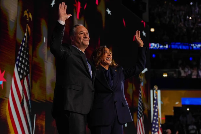Vice President Kamala Harris and Second Gentleman Douglas Emhoff wave to the crowd after the final night of the Democratic National Convention.
