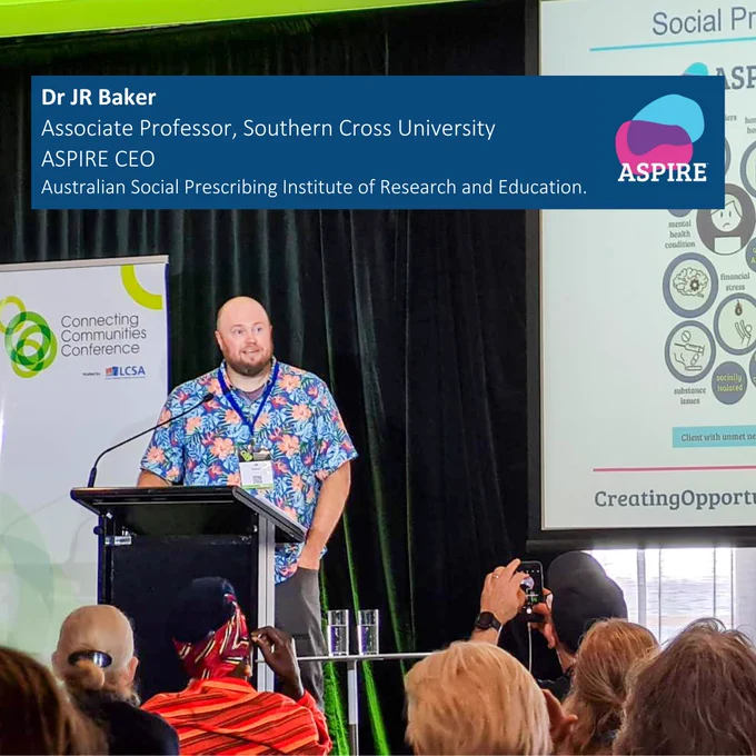 Photograph of Dr J.R. Baker in presentation at the LCSA conference this week