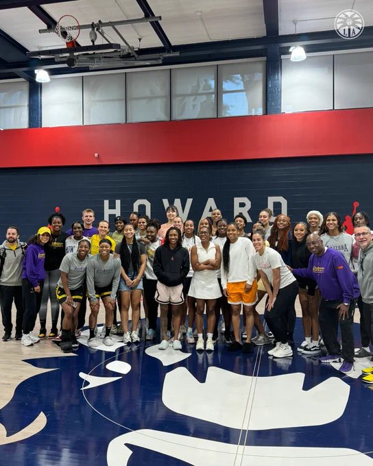 The Sparks and Howard University WBB team and staff taking a photo together. 