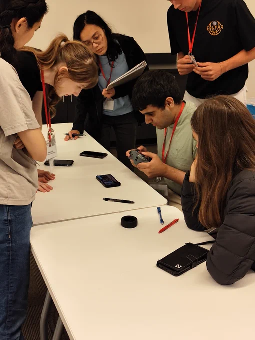 Red Team controlling the rover with the controller grouped around 