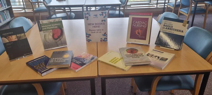 New books displayed on a table.