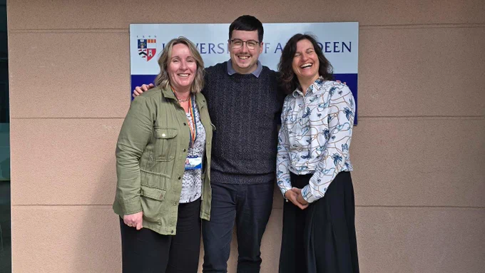 The UKAR team @lauramoir66, Jay Woods and @reb_parr stand in front of the University of Aberdeen Health Sciences Building