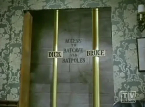 Screenshot from the Adam West Batman series that shows Dick and Bruce's batpoles, which lead to the Batcave.
