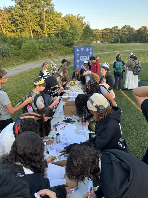 Seniors decorating crowns at a table