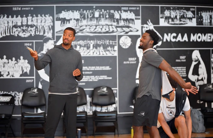 Bensley Joseph talking to Coach English before practice