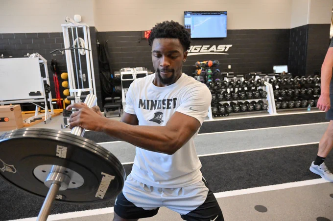 Bensley Joseph lifting in the weight room