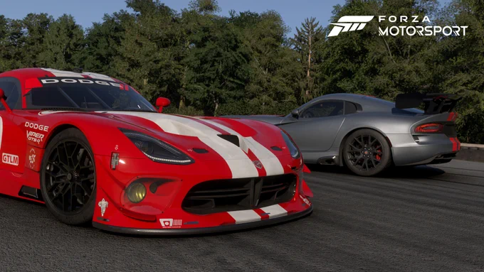 This screenshot shows 2 Vipers parked at Road America on a sunny afternoon. The Forza Motorsport logo is in the upper right corner. 
