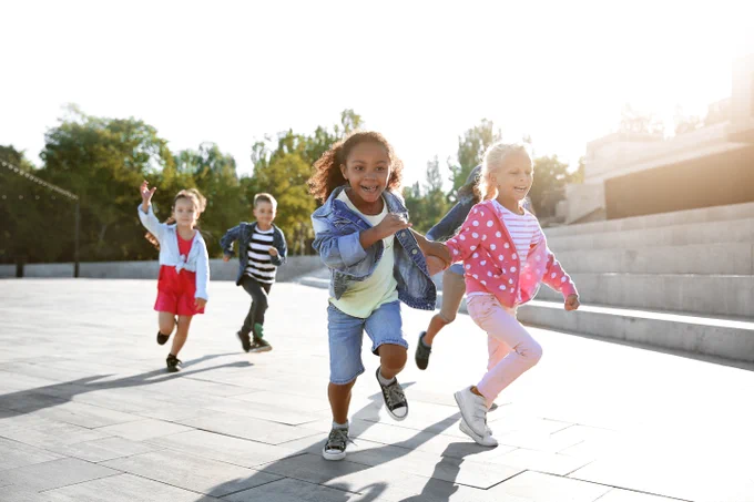 Young children running outside.

Source: Adobe Stock