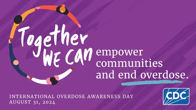 A group of people holding hands in a circle with the text "Together we can empower communities and end overdose."
