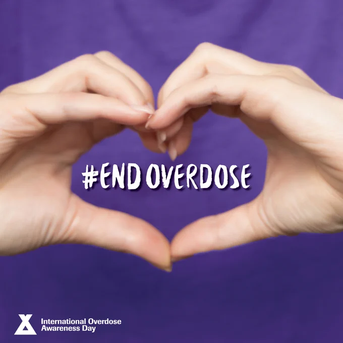 Two hands forming a heart shape, with the words “#EndOverdose” in the middle. International Overdose Awareness Day logo.