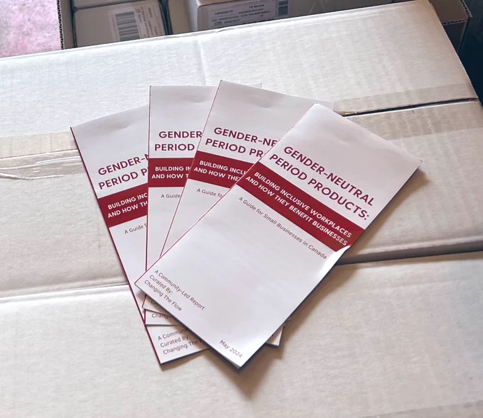 4 pamphlets fanned atop white boxes. Pamphlet says gender neutral period products