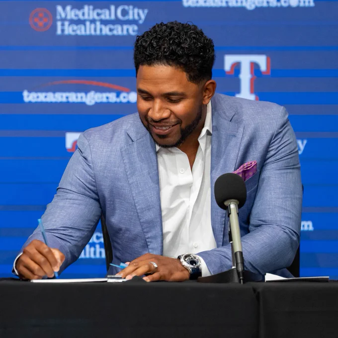 Elvis Andrus signing a one-day contract to retire as a Texas Ranger.
