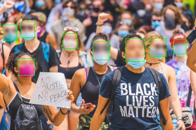 Edited version of “A young woman wearing a mask and Black Lives Matter t-shirt during a #BlackLivesMatter public demonstration in Cincinnati.” (Credit: Julian Wan on Unsplash; Clare Garvie for face-redacted version). 