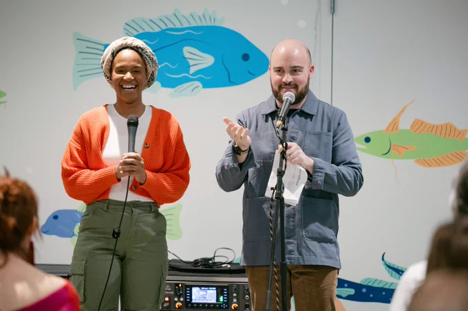 Hosts Christine Williams and Zack Stovall on stage at Pier 57 at Hudson River Park.