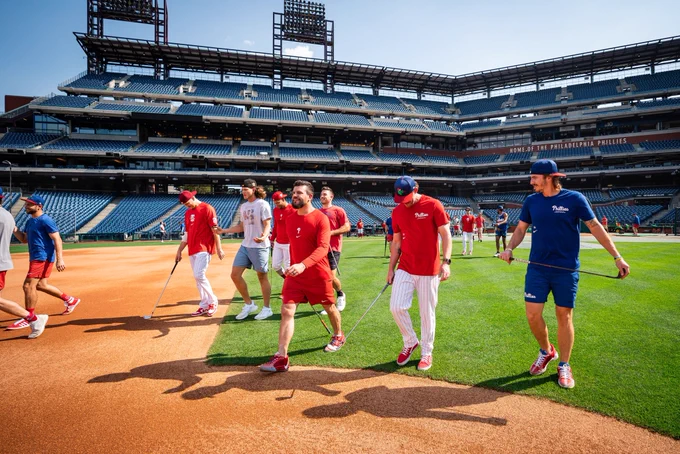 The Phillies walk out to center field to see who show closest to the pin