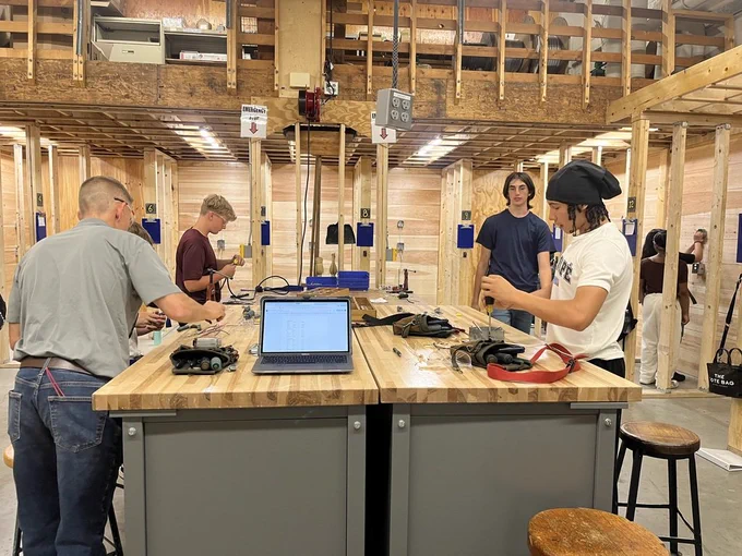 Students learning from their electrical instructor