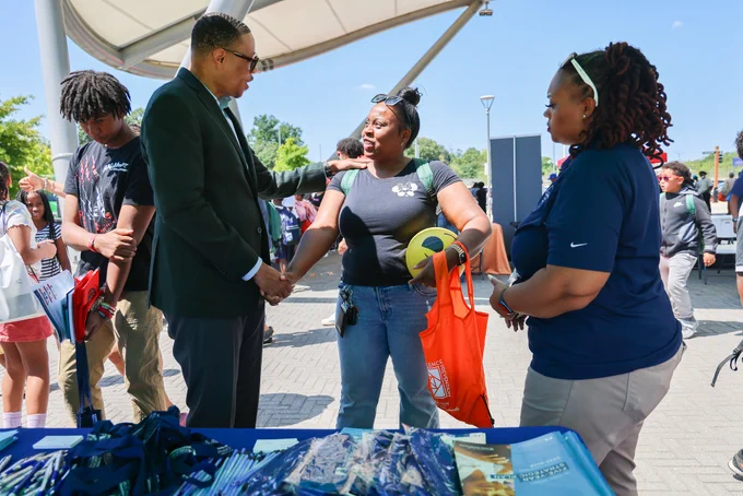 Chancellor Ferebee shakes hands with an attendee. 