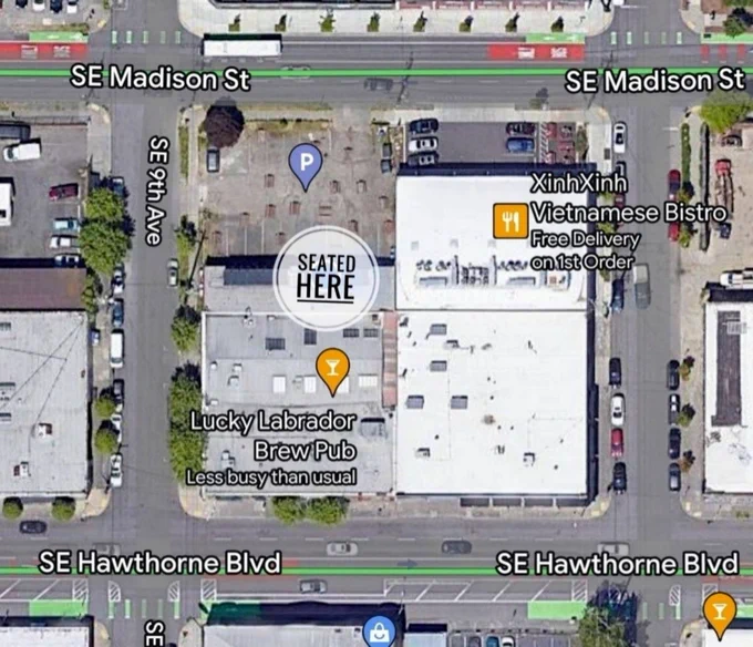 A map showing the block that Lucky Lab is on, indicating that the group is seated outside under the covered area, closer to the parking lot along Madison Street.
