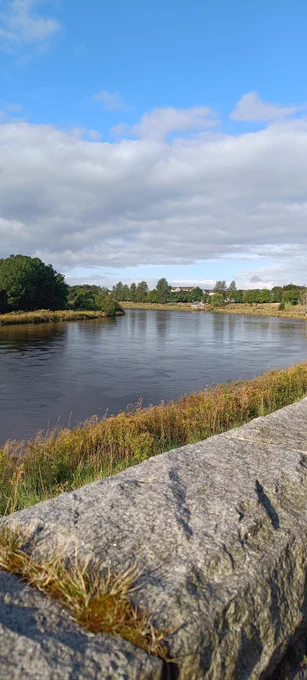 Blue sky over meandering river