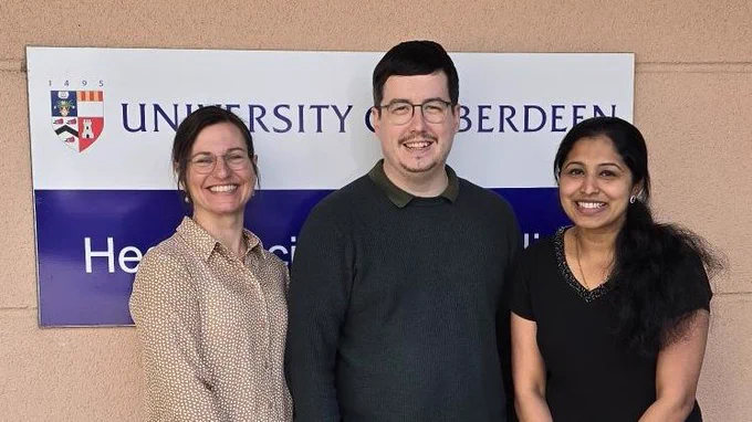 The #UKARStudy team @reb_parr, Jay Woods and @DennisJisha are standing outside the University of Aberdeen Health Sciences Building.