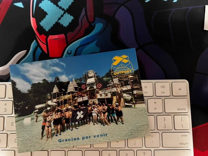 A photo of X-Teamers in a water park on a keyboard on an X-Team desktop mat