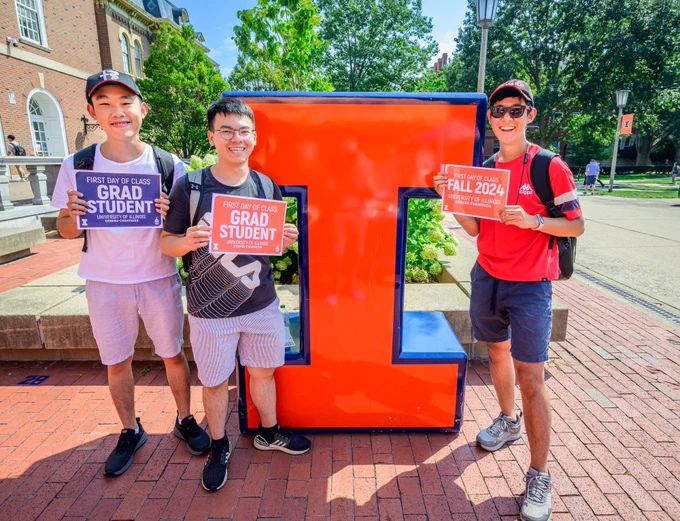 Students pose in front of an Illinois "Block I" on the first day of classes. 